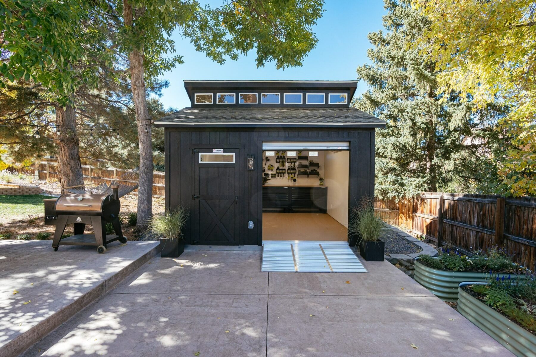 Black Tuff Shed with clerestory upgrade and canister rollup door