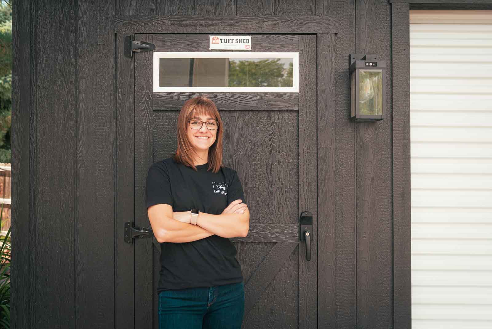 woman in front of Tuff Shed with keyless door handle